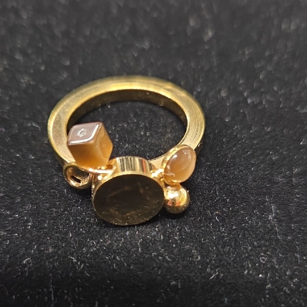 Elegant Gold Ring with Gemstone Accents